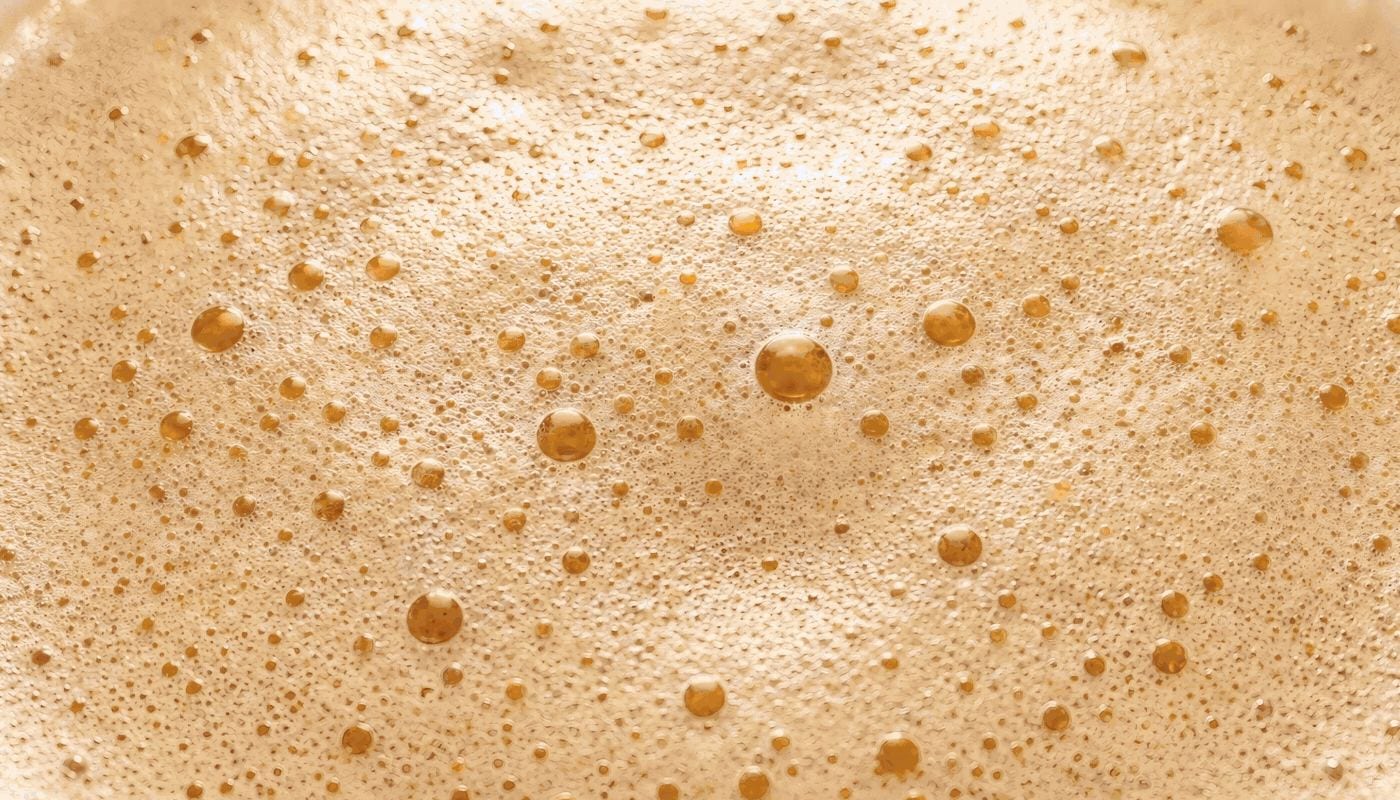 Close-up of lager foam bubbles