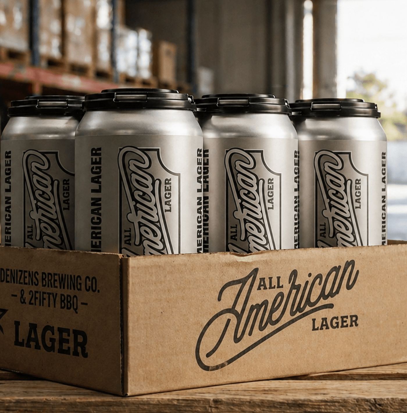 A four-pack of cans sitting in an All American Lager kraft case