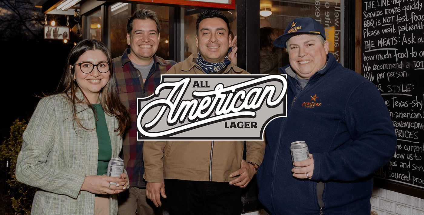 Four guests holding cans at the reveal, the All American Lager script lockup set over them