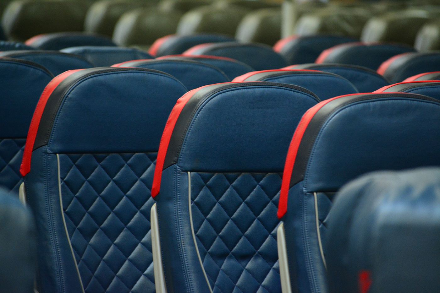 Rows of blue aircraft seats