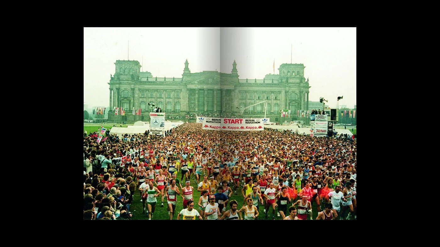 A spread showing the marathon start in front of the Reichstag