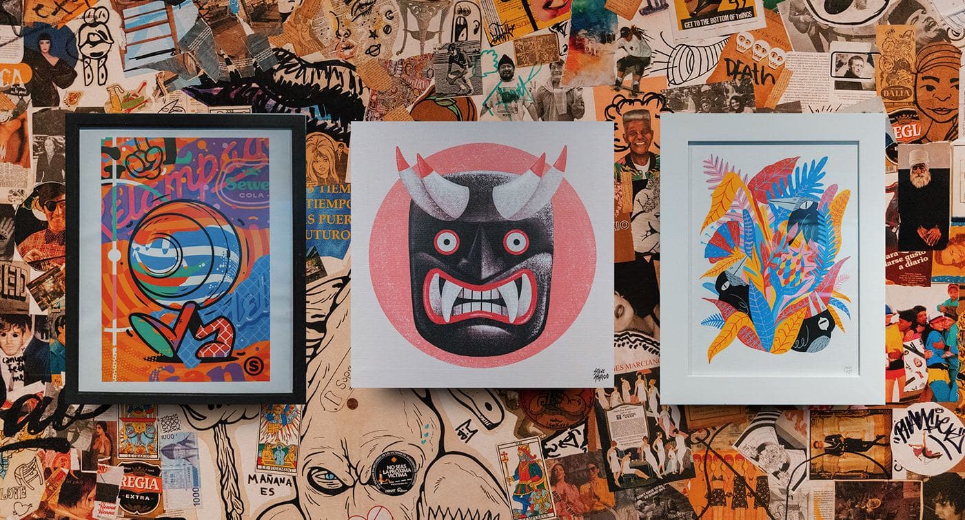 Three framed illustrations on a sticker-covered wall