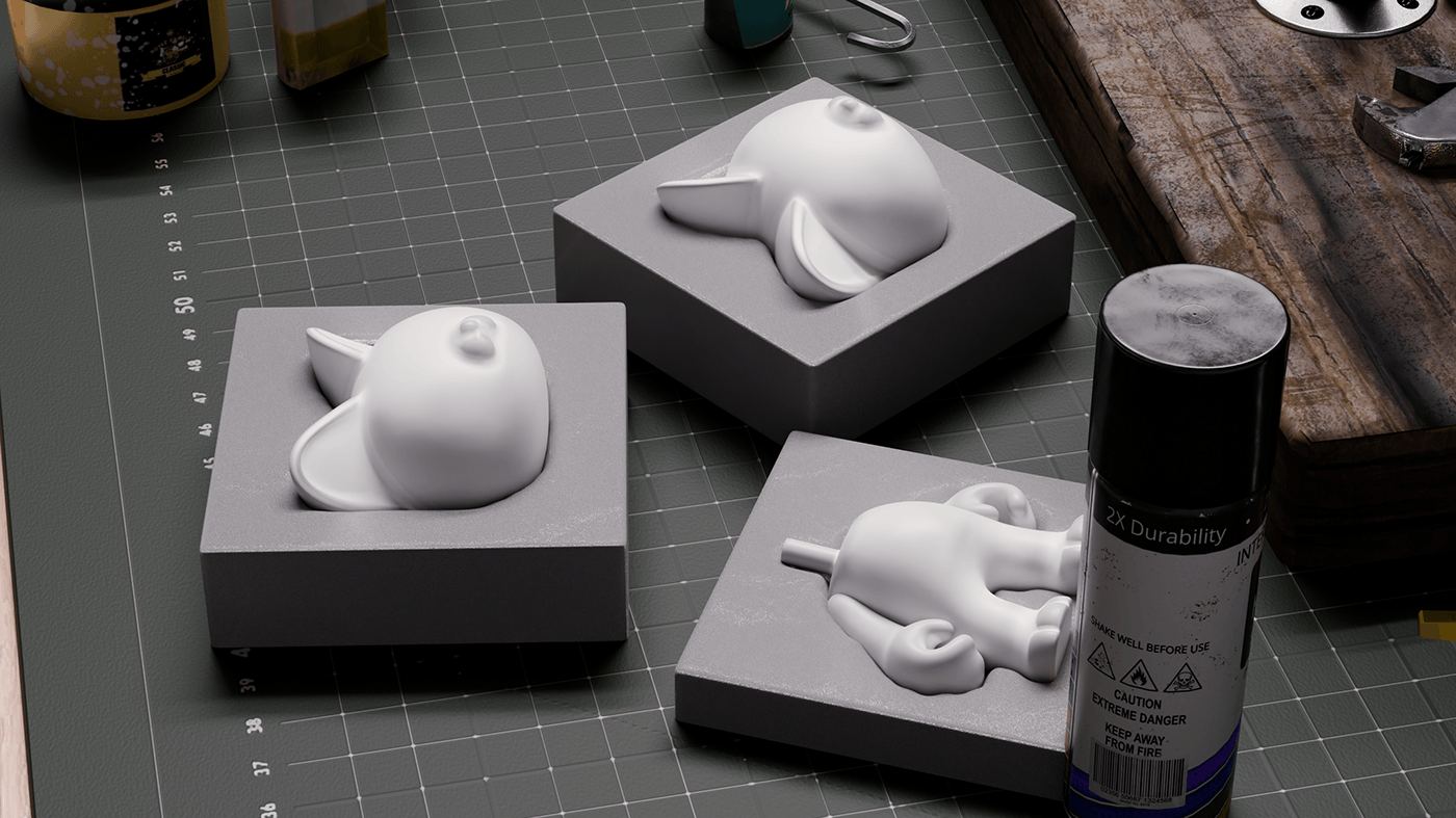 White moulds of Burukatz parts on a cutting mat