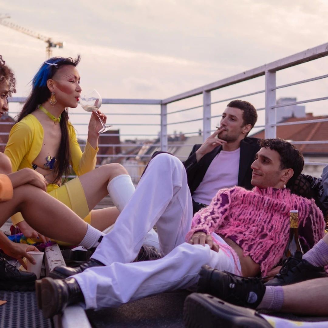 Students relaxing together on a Berlin rooftop