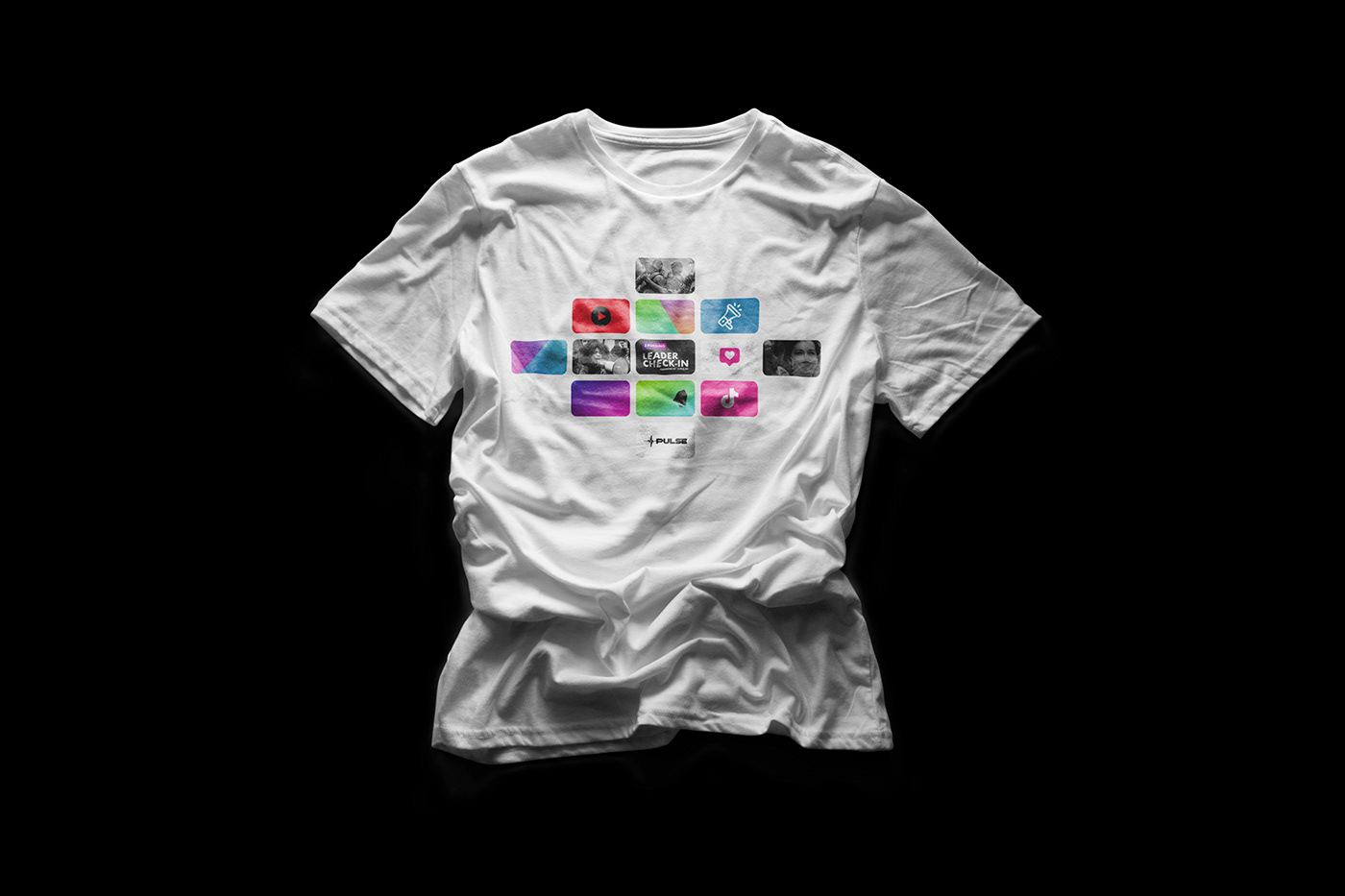White event tee with the Leader Check-In tile grid