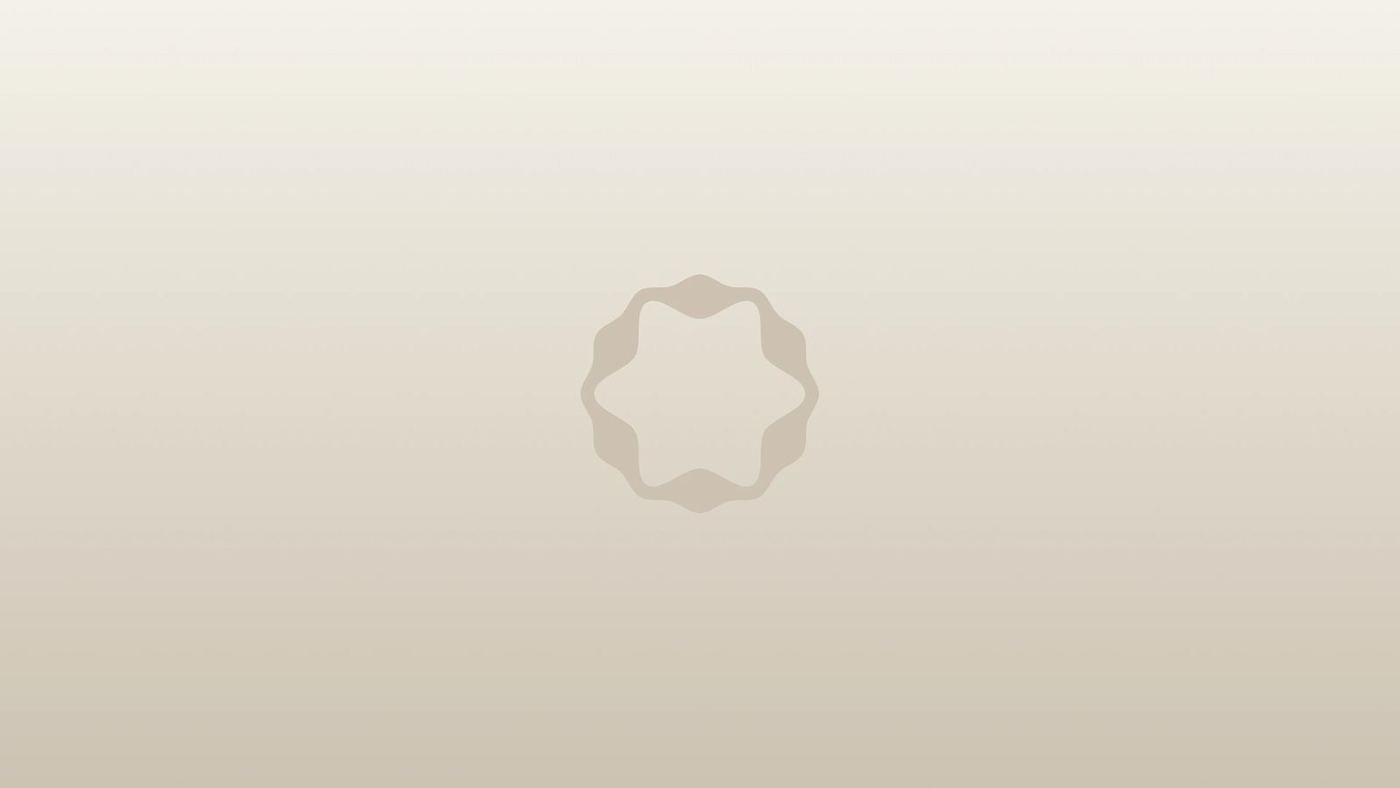 The EyeMatch symbol embossed on a warm grey gradient
