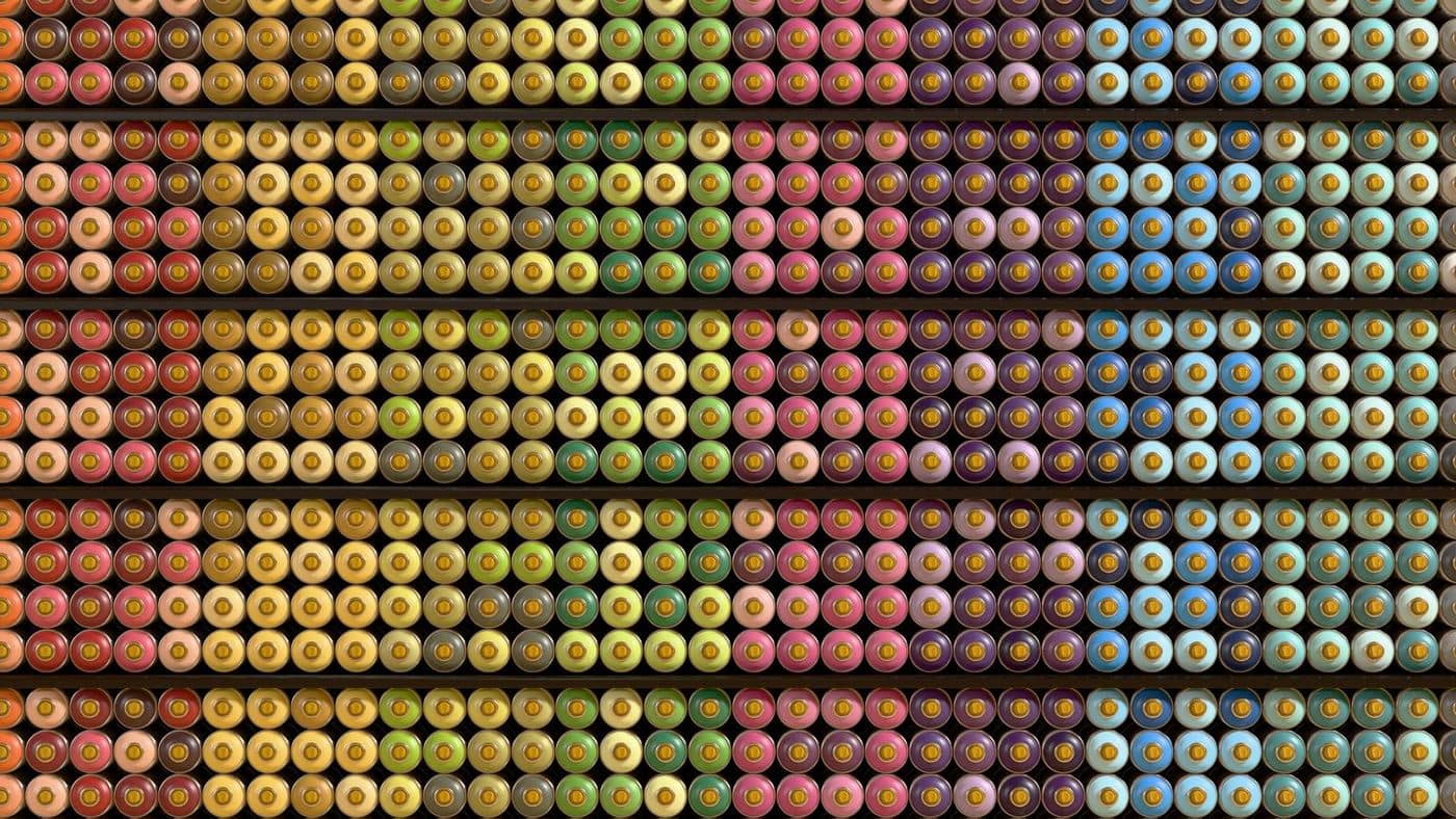 Rows of spray-paint can caps graded by colour