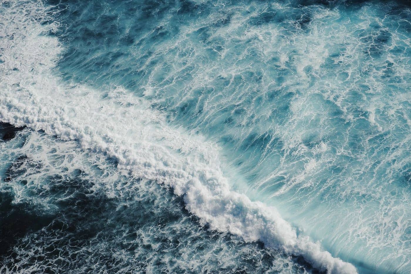 Aerial view of a wave breaking